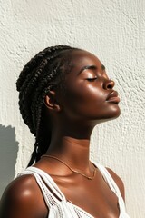 African American Woman Enjoying the Warmth of Sunlight on Her Face