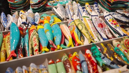 Closeup of decorated local ceramic Sardines in Portuguese souvenir store in Lisbon, showcasing local craftsmanship and vibrant artwork symbolize prosperity, good luck, and abundance.