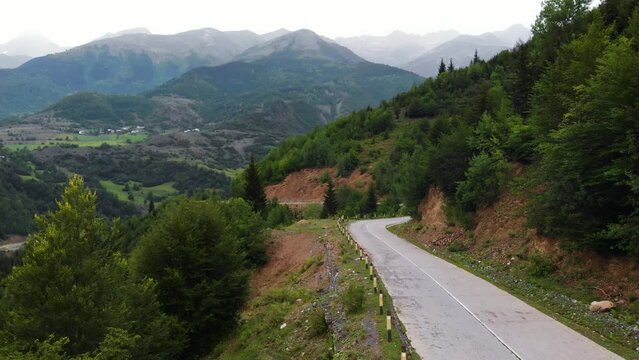 Summer mountain valley, beautifull road way to Mestia. Tsalanari, Hebudi, Georgia. Nature and car travel concept. Asphalt road among the mountains. Aerial view.