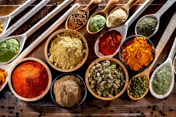 Fotobehang Composition with assortment of spices and herbs © monticellllo