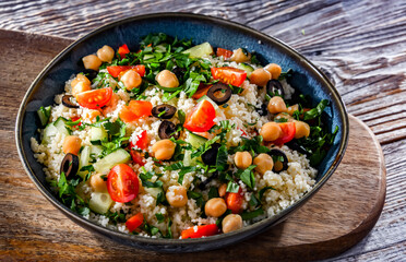 A plate of couscous served with vegetables and chickpeas
