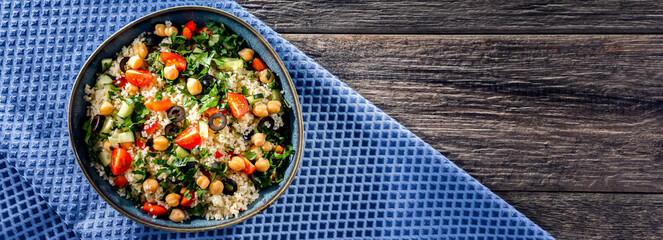 A plate of couscous served with vegetables and chickpeas