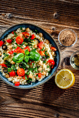 A plate of couscous served with vegetables and chickpeas
