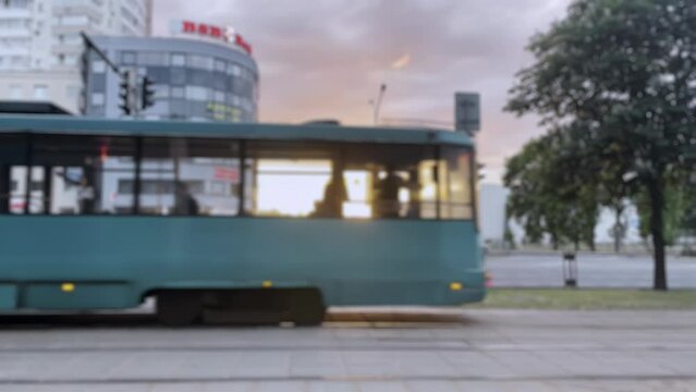 blurred frame, urban sunset, urban tram, urban bustle, tram passage