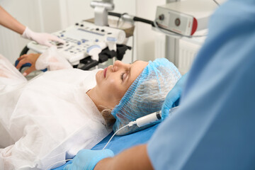Fototapeta premium Selective focus of pregnant patient having examining in reproductive clinic