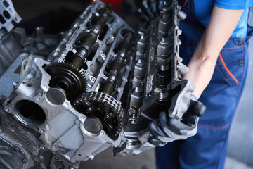 Fototapeta na wymiar Professional repair of a car engine in car repair shop