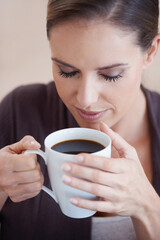 Woman, coffee and aroma, relax in apartment for comfort or morning routine with warm drink. Caffeine beverage, latte or espresso smell with peace and calm for chill at home with positive attitude