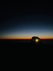 Van parked at the ocean coast, dark night