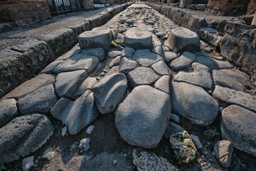 Stepping stones for pedestrians of street in Ancient Roman city Pompeii