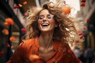 A stylish woman with long, flowing hair and chic glasses beams with joy while basking in the warm, outdoor sunlight