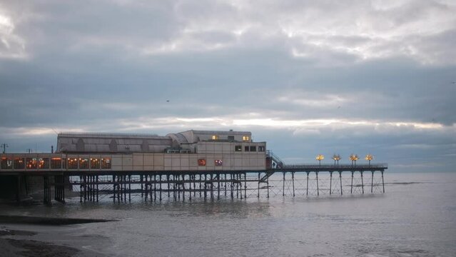 View of the pier at the beach in Aberystwyth, Wales 