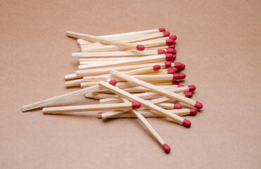 Pile of new unlit wooden matchsticks on white background