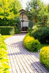Stone path to the gazebo in the summer garden