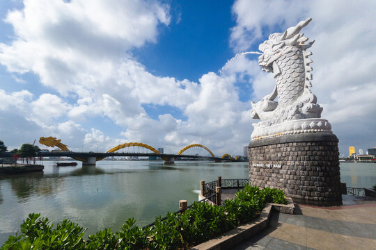 dragon carp statue and the skyline of danang in vietnam