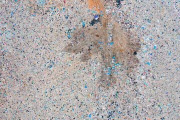 Aerial view of stack of different types of large garbage pile, plastic bags, and trash with a tractor car in industrial factory in environmental pollution. Waste disposal in dumping site.