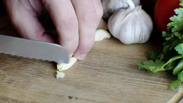 Garlic chopped with knife to be used in dinner dish	