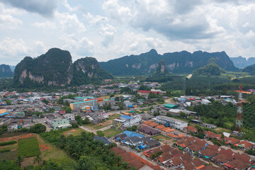Fototapeta na wymiar Aerial top view of Samet Nangshe, Phang Nga with city town, lush green trees from above in tropical forest in national park in summer season. Natural landscape. Pattern texture background.