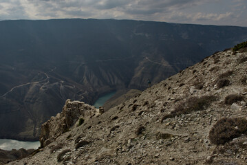 Russia. North-eastern Caucasus. The Republic of Dagestan. A dizzying panoramic view of mountain serpentines on the slopes of the Sulak canyon from the steep cliffs of the village of Dubki.