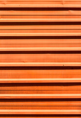 Fototapeta premium Orange corrugated metal plate surrounding wasteland