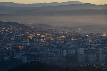 Panorama view of the skyline of the Galician city of Ourense at dusk as seen from the outskirts. - 714069552