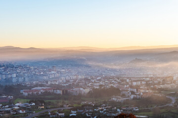 Panorama view of the skyline of the Galician city of Ourense at dusk as seen from the outskirts. - 714069711