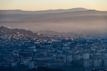 Panorama view of the skyline of the Galician city of Ourense at dusk as seen from the outskirts. - 714069780