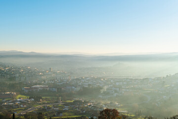 Panorama view of the skyline of the Galician city of Ourense at dusk as seen from the outskirts. - 714069992