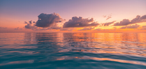 Inspirational calm sea with sunset clouds sky. Meditation ocean and sky background. Colorful...
