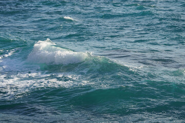 Mediterranean Sea. Sea wave. An abstract background of seawater flow under light exposure