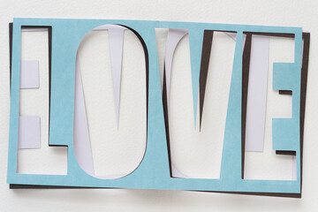 simple machine-cut paper sign with the word 