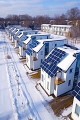 Obraz premium Eco-friendly apartment buildings with large solar panels on roofs surrounded by bright autumn trees