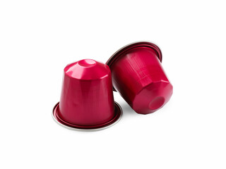 Two plastic coffee capsules isolated on white