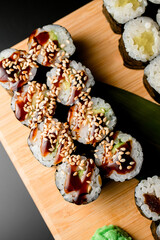 Top view of rolls with teriyaki sauce and sesame