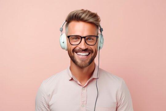 Male call center worker in headphones with microphone. A guy using a headset to talk to clients on the phone. Concept: promotion of services and remote assistance by telecom operator. Banner with copy