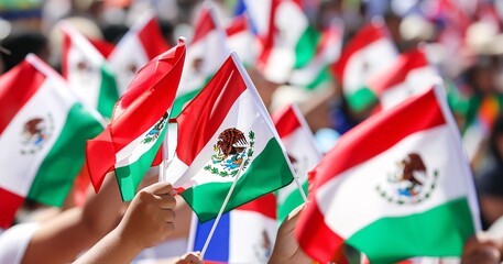 A gathering of individuals brandishing miniature Mexican flags. - obrazy, fototapety, plakaty