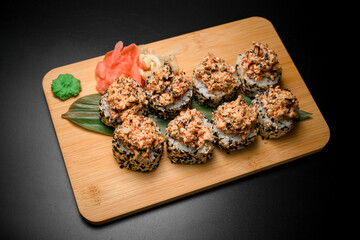 Sushi set with caviar and crab, sprinkled with colored sesame seeds