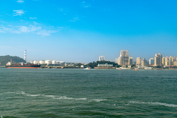 Ships docked at the port and city skyline, Xiamen, China