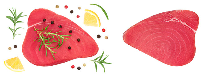 Fresh tuna fish fillet steak with rosemary, lemon and peppercorns isolated on white background . Top view. Flat lay