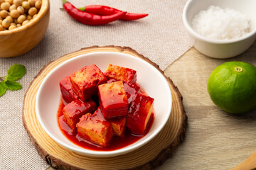 Fermented bean curd in white plate(Red Sufu) ,Chinese Cheese