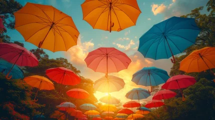 Fotobehang colorful umbrellas floating against a vibrant sky, symbolizing imagination and creativity © Nico