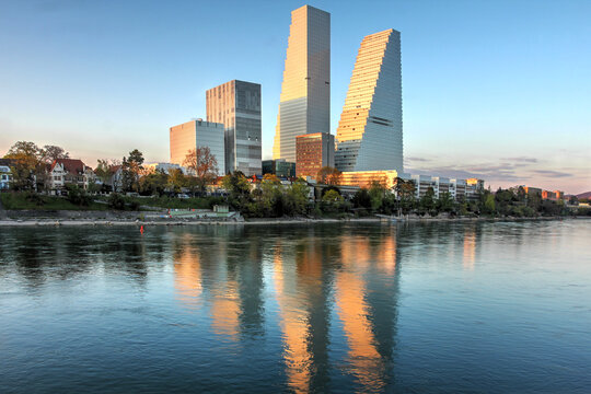 Roche Towers under golden light in Basel, Switzerland