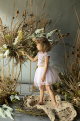 little elf girl in flowers