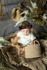 small child in a costume and fairy-tale decorations