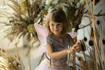 little elf girl in flowers