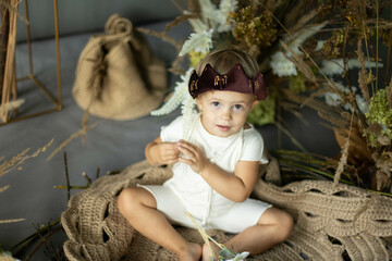 small child in a costume and fairy-tale decorations