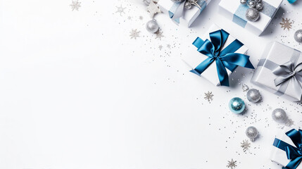 Christmas Day Concept: Top View Photo of Trendy Blue, White, and Silver Baubles, Gift Boxes, and Fir Branches in Snow on Isolated White Background with Copy-Space for Text or Promotional Content.