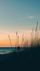 A serene seaside view at golden hour and the silhouette of a couple on the beach. Copy Space.