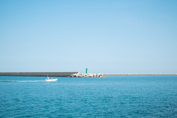 Fototapeta na wymiar View of breakwater and sea