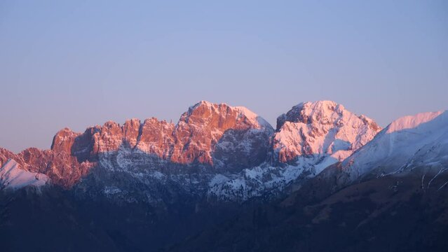 Sunrise over rocky mountain landscape, early morning in the Italian Dolomites, Schiara and Gusela del Vescovà, Italy