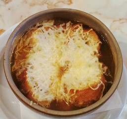 Traditional French food, onion soup. Delicacy in Paris.
